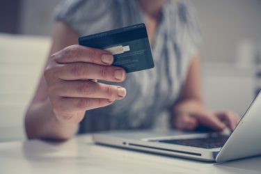 Close,Up,Of,Woman,Hand,Using,Credit,Card.