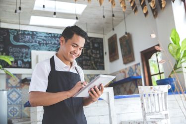 Portrait,Of,Asian,Young,Male,Cafe,Owner,With,Tablet