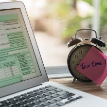 Tax,Time,Post-it,On,Alarm,Clock,And,Individual,Income,Tax