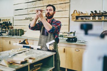 Bearded,Carpenter,Enjoying,Hobby,Working,Process,At,His,Workstation,Of
