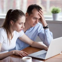 Upset,Millennial,Couple,Disappointed,Losing,Money,In,Online,Lottery,,Worried