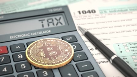 Close-up,View,Of,A,Bitcoin,Coin,,An,Electronic,Calculator,And
