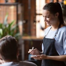 Smiling,Female,Waitress,Take,Order,Talk,To,Clients,Cafe,Restaurant