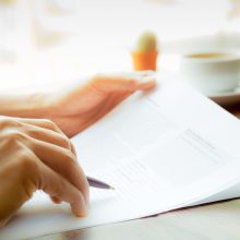 Business,Man,Hand,Holding,Pen,Over,Agreement,Form