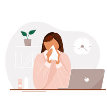 Young,Woman,With,Flu,Sitting,At,Laptop,In,Office,Until