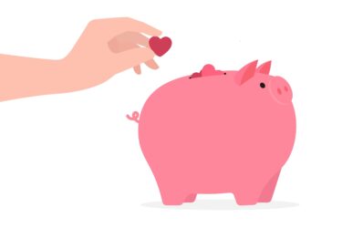 Hand,Placing,Heart,Into,Pink,Piggy,Bank,Symbolizes,Love,investment,And
